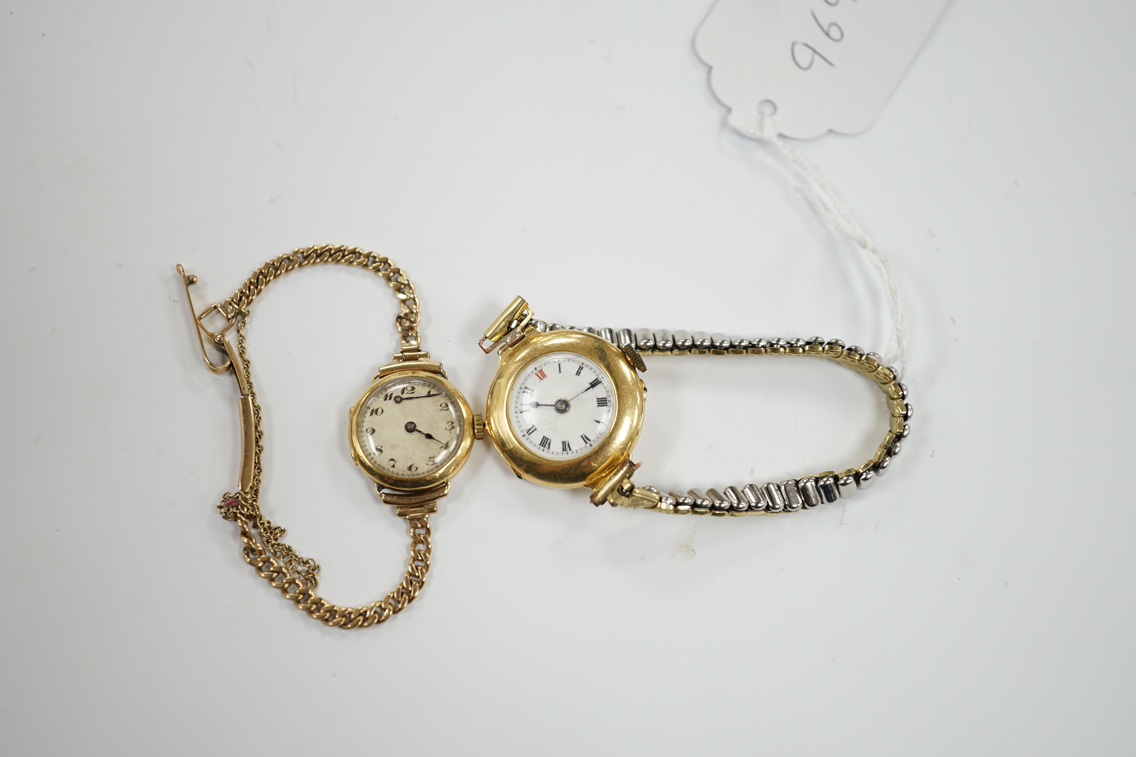 A lady's early to mid 20th century 18ct gold manual wind wrist watch on a 9ct bracelet, together with one other similar 18ct gold manual wrist watch, on a flexible gold plated flexible bracelet.